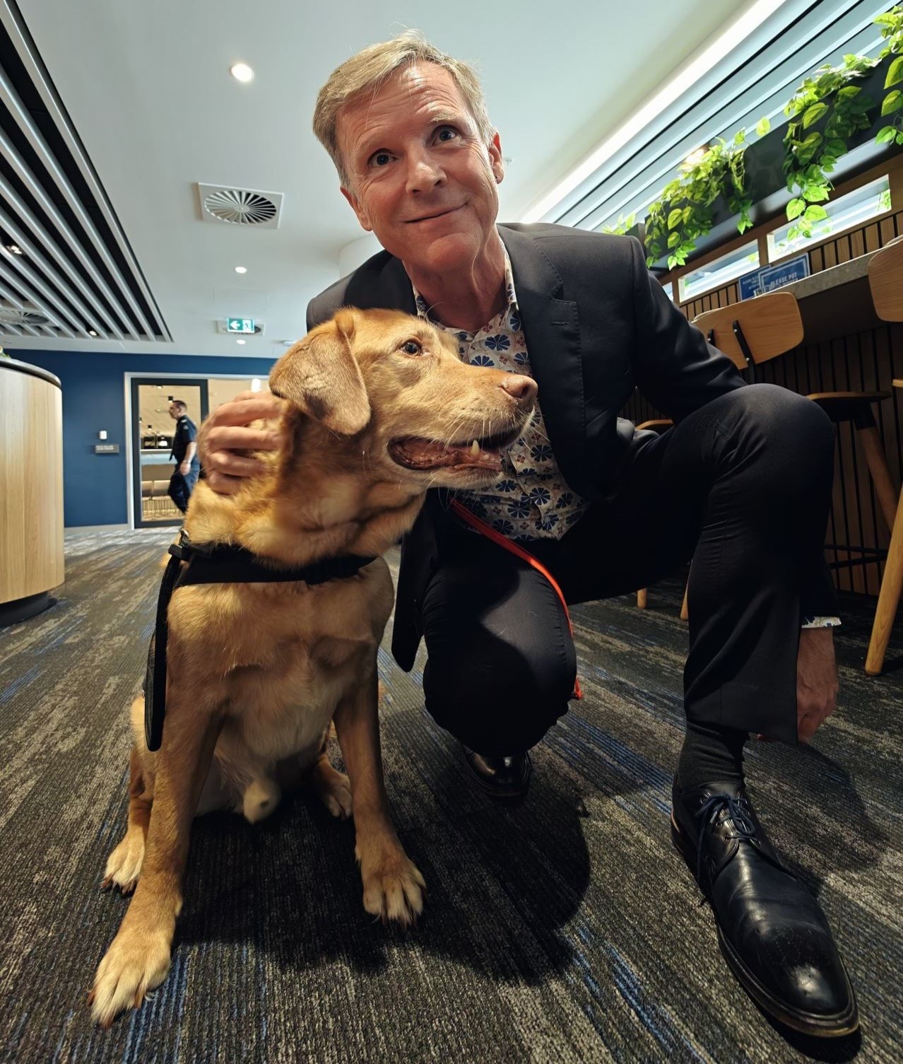 Victorian Public Advocate Dan Stubbs with Champ the therapy dog.